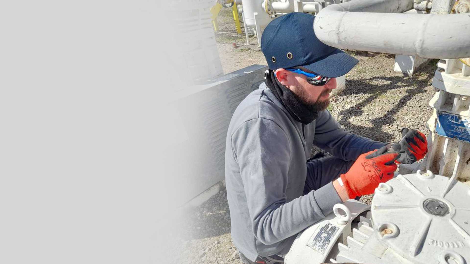 Photo of a man doing preventative maintenance